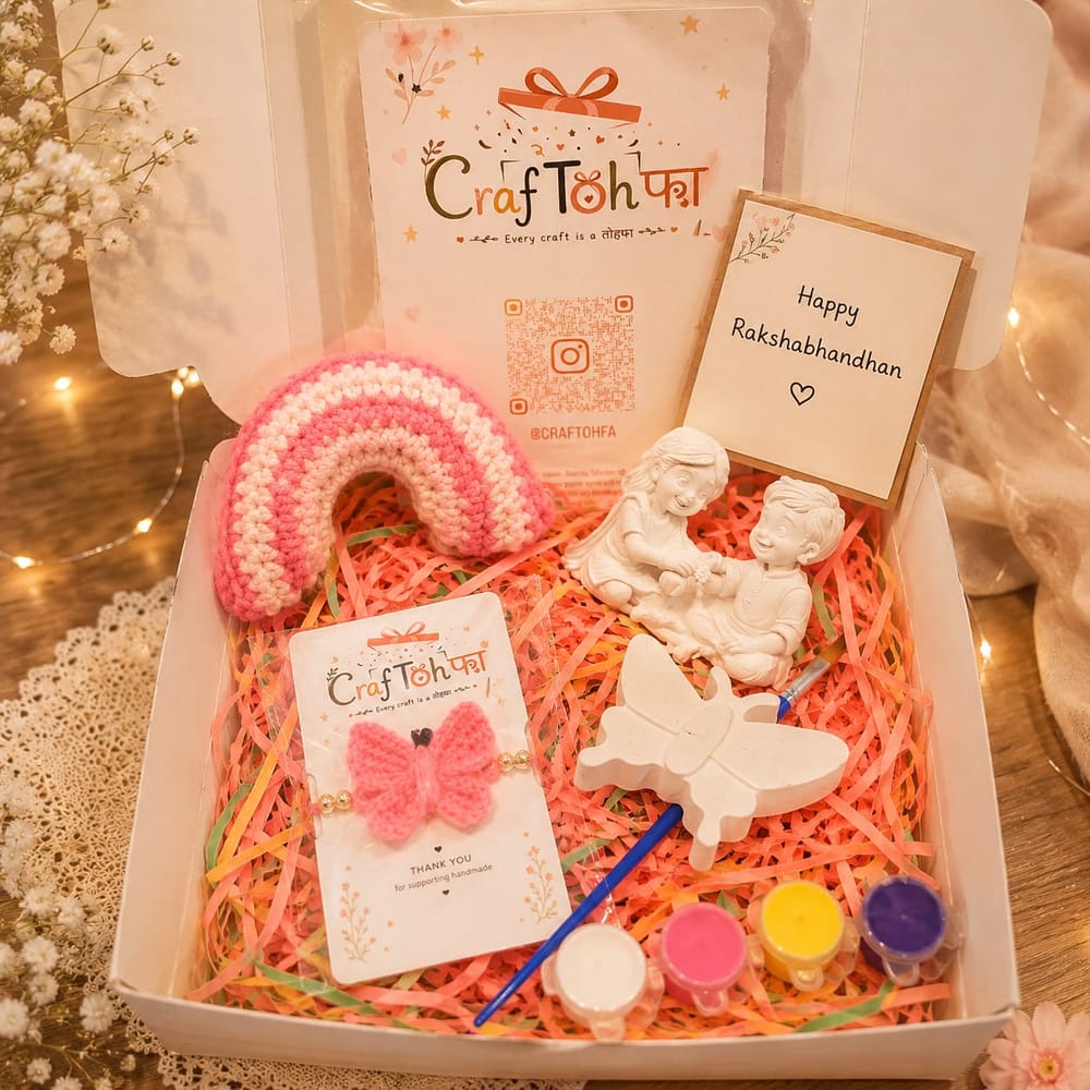 Butterfly and rainbow combo box with a pink crochet rainbow, a crochet butterfly charm, an idol and a plaster butterfly with four paint pots